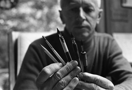 Charles M Schulz holding his drawing tools in 1969