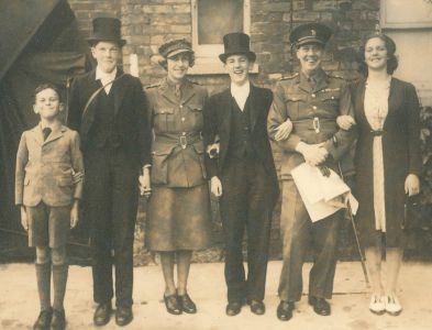 Photograph of Lionel and Ethel Whitby in military uniform with their children