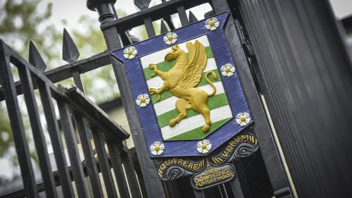 The Downing crest on the front gates